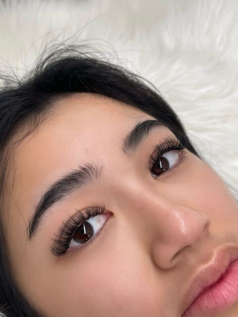 Wispy natural lash extensions close up